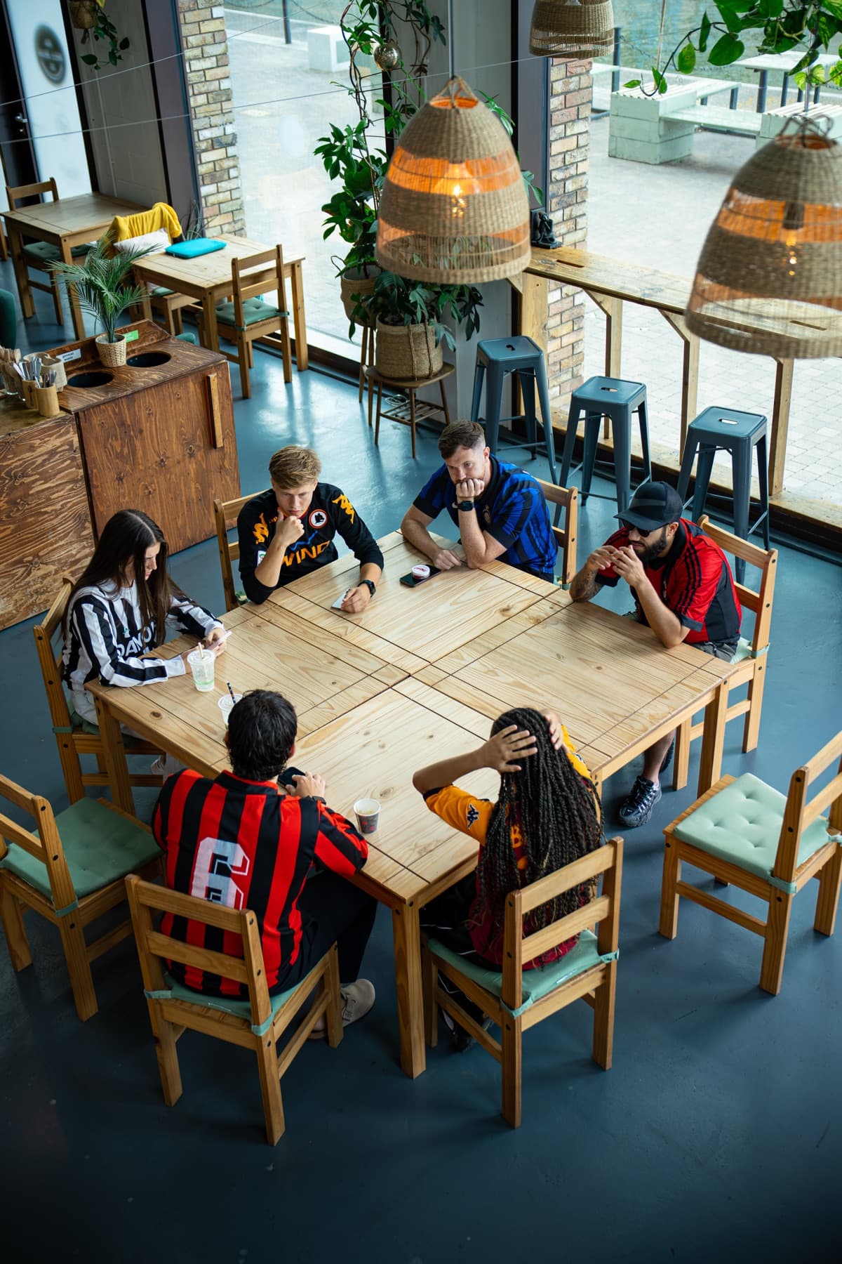 Football shirt collectors gathered around a table at FC Classico