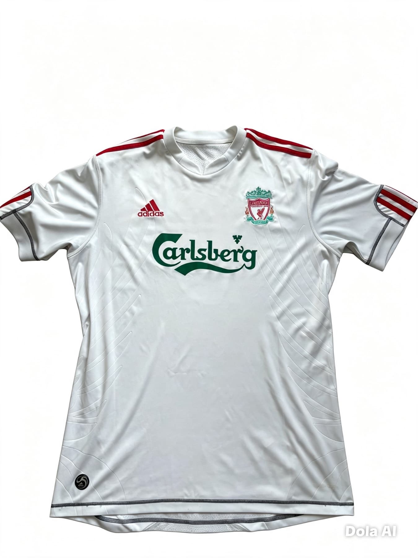 Front of a white vintage Liverpool 2009/10 away football shirt. Features red Adidas shoulder stripes, a green Carlsberg sponsor logo, and the Liverpool FC team crest.